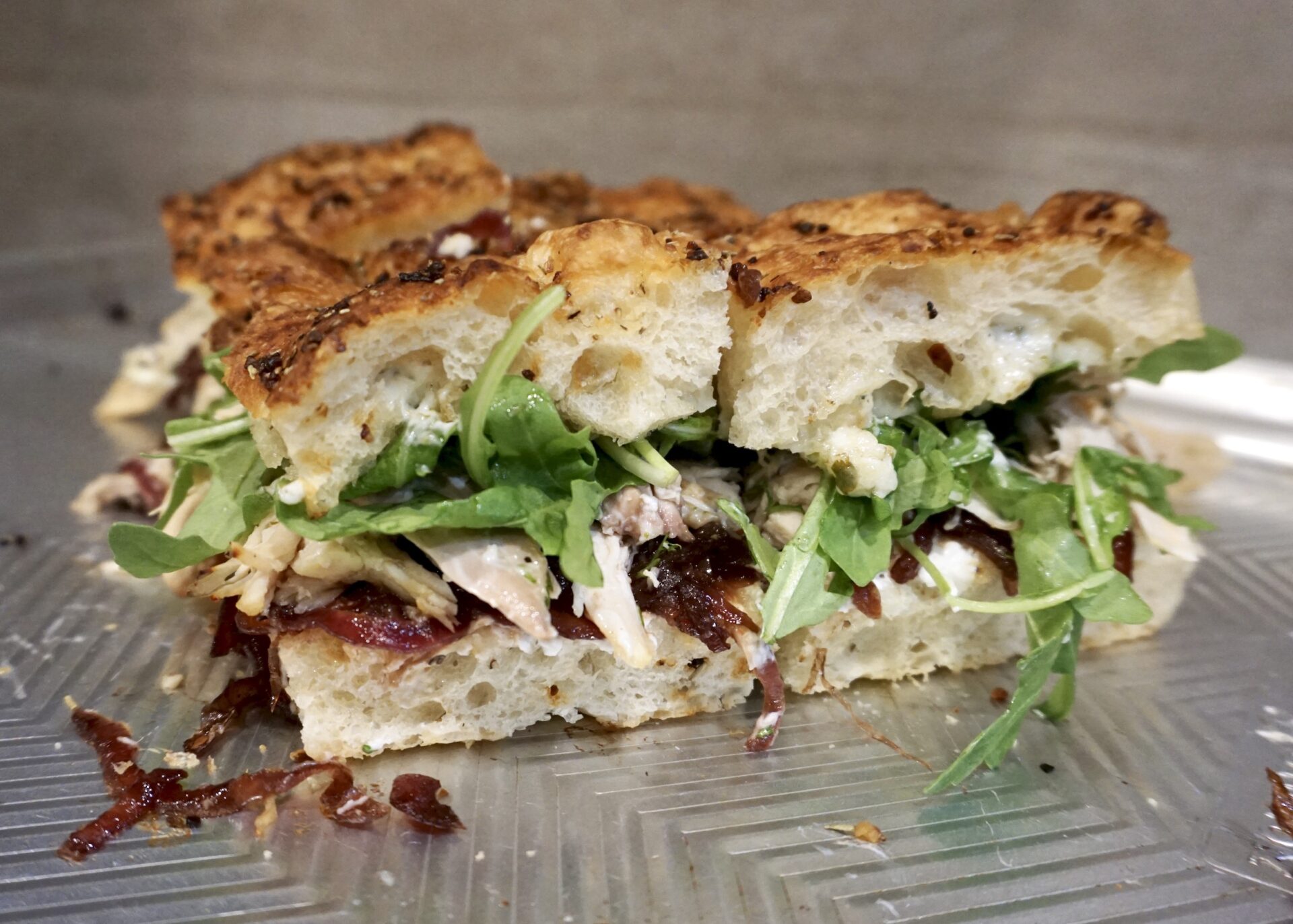 Roasted Chicken Focaccia Sandwich with Goat Cheese, Red Onion Jam, and Herb Aioli A Hint of Honey